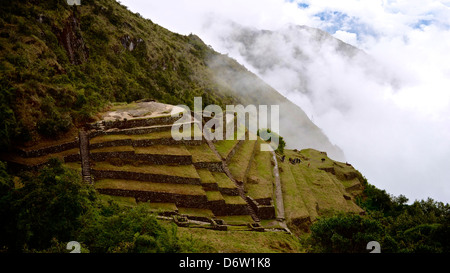 Inca ruins above the clouds on the trail to Machu Picchu, Peru Stock Photo