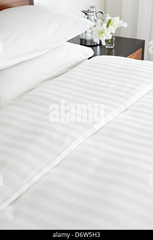 crisp cotton made bed sheets pillows Stock Photo