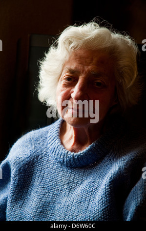 Portrait of old woman looking at the camera. Close view. Stock Photo