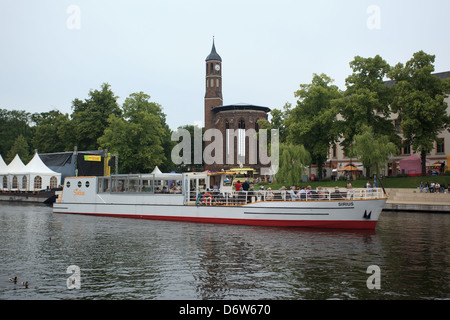 Brandenburg an der Havel, Germany, St. John's Church on Salzhofufer and a ship on the river Havel Stock Photo
