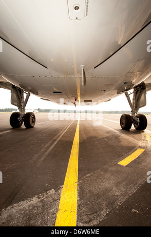 Undercarriage of jet plane - aircraft pictured from below Stock Photo