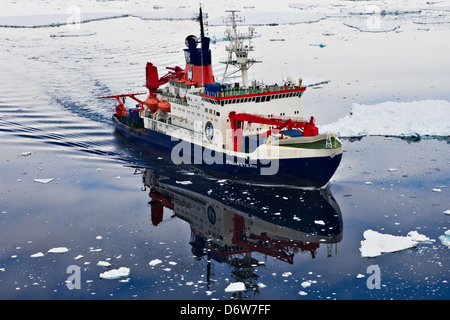 The RV Polarstern research ship leaves the Antarctic ice shelf to continue polar reseach Stock Photo