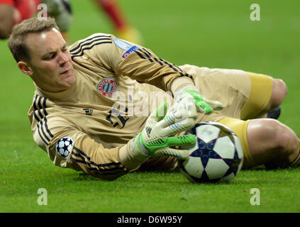 Munich's goalkeeper Manuel Neuer saves the ball during the UEFA Champions League semi final first leg soccer match between FC Bayern Munich and FC Barcelona at the Arena in Munich, Germany, 23 April 2013. Photo: Andreas Gebert/dpa Stock Photo