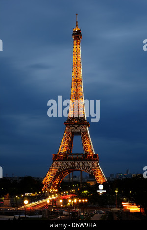 Eiffel Tower at sunset, sparkling Eiffel Tower at night, weekend in romantic Paris, icon of Paris, iconic structure Paris Stock Photo