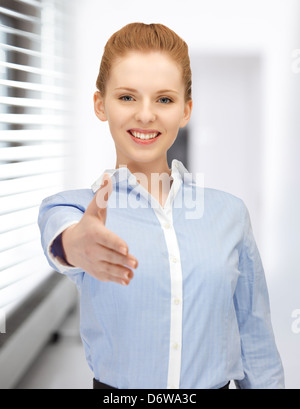 woman with an open hand ready for handshake Stock Photo