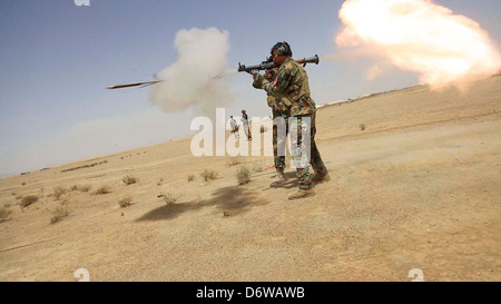 Afghan National Army Special Forces soldiers fire a rocket propelled grenade during training April 20, 2013 in Washer district, Helmand province, Afghanistan. Stock Photo