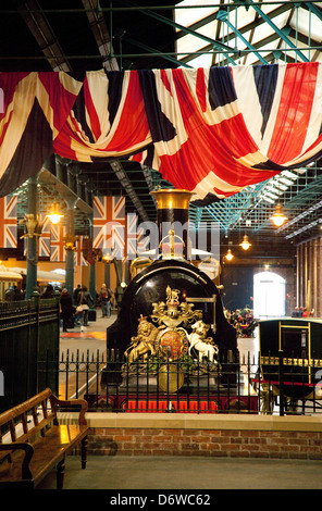 A steam engine locomotive and union jack flags at  the National Railway Museum, York, Britain, UK Stock Photo