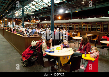 Family eating and drinking in the "Brief Encounter" cafe, National Railway museum York Yorkshire UK Stock Photo