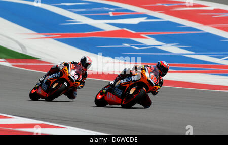 April 19, 2013 - Austin, Texas, USA - April 19, 2013. Austin, Texas, USA. MATTIA PASINI (54) and ALEX DE ANGELIS (15) during the Friday practice session for the Red Bull  Moto2 at the Circuit of the Americas in Austin, Texas. (Credit Image: © Ralph Lauer/ZUMAPRESS.com) Stock Photo