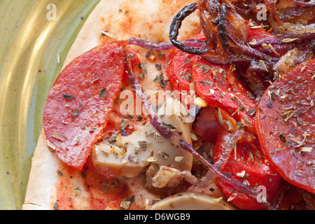 gluten free and cheese/ dairy free pizza with pepperoni  and red onion Stock Photo