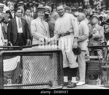 President Coolidge shaking hands with Walter Johnson at Griffith Stadium, circa 1925 Stock Photo