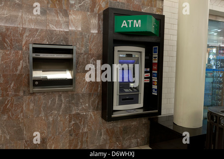 ATM machine on wall Stock Photo