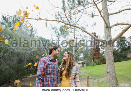 Romantic young couple looking at each other in park