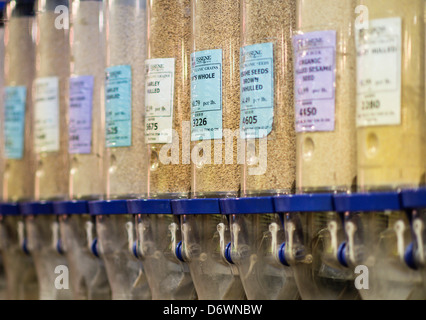 Whole organic grains in a store dispenser. Stock Photo