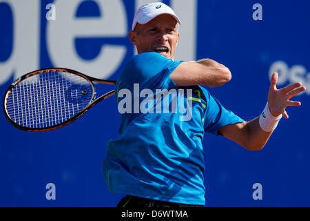 Barcelona, Spain. 23rd April, 2013. Nikolay Davydenko of Russia plays a forehand to during day two of the ATP 500 World Tour Barcelona Open Banc Sabadell 2013 tennis tournament game between Nikolay Davydenko of Russia and Tomas Berdych of Czech Republic at the at the Real Club de Tenis  Barcelona Stock Photo