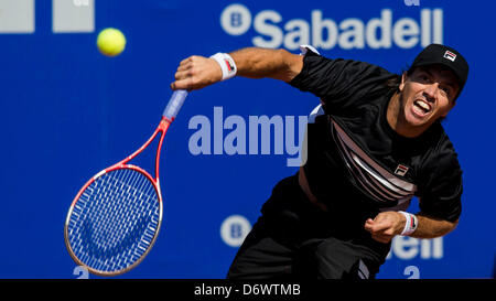 Barcelona, Spain. 23rd April, 2013. Carlos Berlocq of Argenita serves the ball to Daniel Gimeno Traver of Spain during day two of the ATP 500 World Tour Barcelona Open Banc Sabadell 2013 tennis tournament game between and at the at the Real Club de Tenis  Barcelona Stock Photo