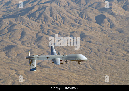 US Air Force MQ-1 Predator unmanned aerial vehicle assigned to the California Air National Guard's 163rd Reconnaissance Wing in flight over Southern California January 7, 2012 in Victorville, CA. Stock Photo