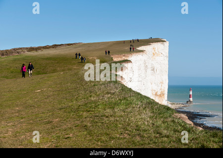 Walkers on Beachy Head in East Sussex. Stock Photo