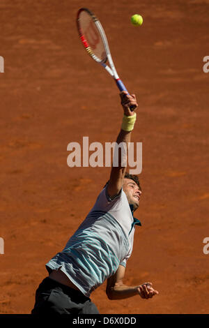 Barcelona, Spain. 24th April, 2013. Grigor Dimitrov of Bulgaria serves the ball to Tommy Robredo of Spain during day three of the ATP 500 World Tour Barcelona Open Banc Sabadell 2013 tennis training at the Real Club de Tenis  Barcelona Stock Photo