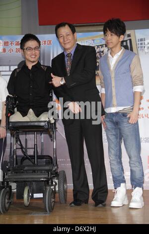 Japanese writer Hirotada Ototake and Chinese singer Michael Wong shared positive spirits with school kids in Taipei, Taiwan, China on Tuesday April 23, 2013. Stock Photo