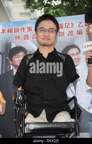 Japanese writer Hirotada Ototake  shared positive spirits with school kids in Taipei, Taiwan, China on Tuesday April 23, 2013. Stock Photo