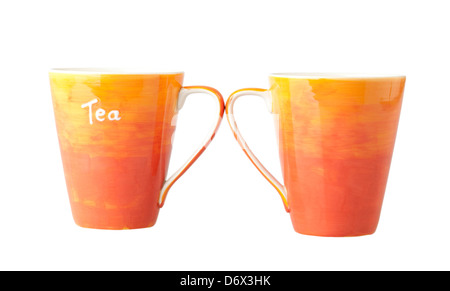 Two colorful porcelain tea mugs on white background Stock Photo