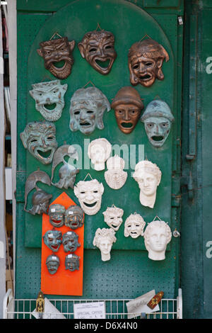 April 24, 2013 - Athens, Greece - A man open his souvenir shop with theatrical masks in old district of Athens, Plaka. (Credit Image: © Aristidis Vafeiadakis/ZUMAPRESS.com) Stock Photo