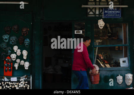 April 24, 2013 - Athens, Greece - A man open his souvenir shop with theatrical masks in old district of Athens, Plaka. (Credit Image: © Aristidis Vafeiadakis/ZUMAPRESS.com) Stock Photo