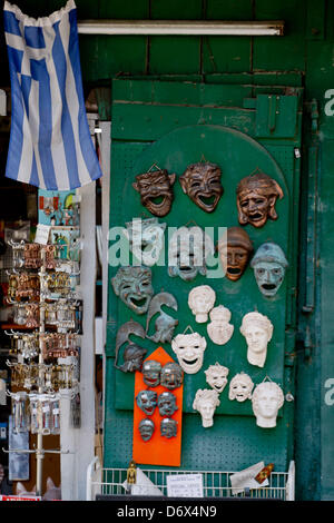 April 24, 2013 - Athens, Greece - A man open his souvenir shop with theatrical masks in old district of Athens, Plaka. (Credit Image: © Aristidis Vafeiadakis/ZUMAPRESS.com) Stock Photo