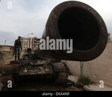 Darkoush, Syria. April 23, 2013. Free Syrian Army soldiers standing on a tank at the central prison on Darkoush, Syria. April 23, 2013. . The prison was bombarded by fights between Al-Assad forces and Fee Army fighters three months ago. Credit: Gallo Images / Alamy Live News Stock Photo