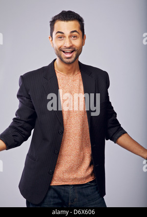 Portrait of a charming guy in a studio happy about something Stock Photo