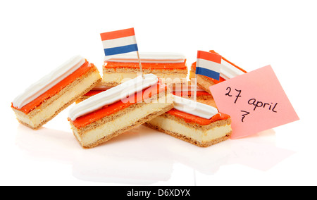 Pile of traditional Dutch pastry called tompouce with flags over white background Stock Photo