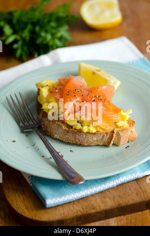 Smoked salmon with eggs on toast Stock Photo