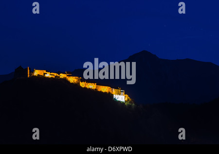 Night view of the Rasnov Fortress from the distance Stock Photo