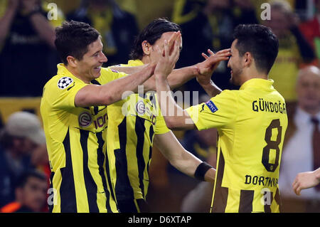 Dortmund's Robert Lewandowski (L-R) celebrates with Neven Subotic (hidden) and Ilkay Guendogan after scoring the 2-1 during the UEFA Champions League semi final first leg soccer match between Borussia Dortmund and Real Madrid at BVB stadium Dortmund in Dortmund, Germany, 24 April 2013. Photo: Friso Gentsch/dpa Stock Photo