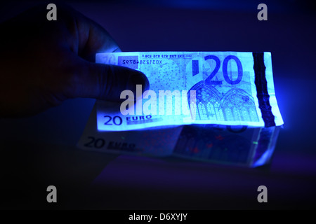 Berlin, Germany, the bill is checked for authenticity Stock Photo