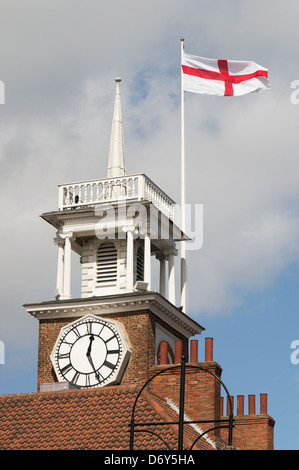 Flag of St George flying above Stockton Town Hall clock, north east England UK Stock Photo