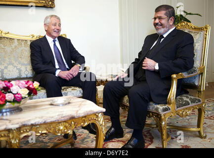 Cairo, Egypt. 24th April, 2013. U.S. Defense Secretary Chuck Hagel speaks with Egyptian President Mohamed Mursi at the Presidential Palace in Cairo April 24, 2013  (Credit Image: Credit:  Tareq Gabas/APA Images/ZUMAPRESS.com/Alamy Live News) Stock Photo