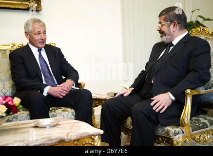 Cairo, Egypt. 24th April, 2013. U.S. Defense Secretary Chuck Hagel speaks with Egyptian President Mohamed Mursi at the Presidential Palace in Cairo April 24, 2013  (Credit Image: Credit:  Tareq Gabas/APA Images/ZUMAPRESS.com/Alamy Live News) Stock Photo