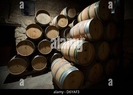 Rioja wine in American oak barrels in cave at Bodegas Agricola Bastida in Rioja-Alaveda area of Basque country, Spain Stock Photo