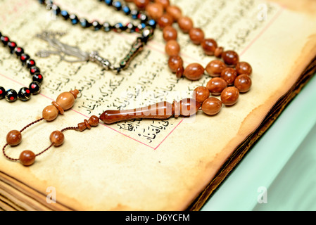 200 years an ancient hand scripted Quran with prayer beads Stock Photo