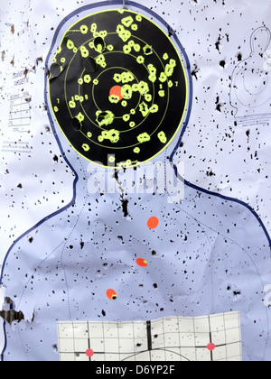 Target at shooting range with bullet holes