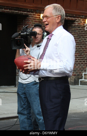 David Letterman filming a football segment for his TV show 'The Late