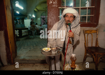 Smoking nargileh or water pipe in a cafe in the old quarter of Damascus Stock Photo