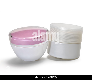 Two cosmetic packages with a lightly brilliant surface, on white background. Stock Photo