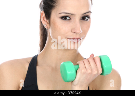 Determined Confident Positive Young Woman Exercising With Dumbbell Weights Isolated Against A White Background With A Clipping Path And Copy Space Stock Photo