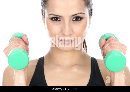 Determined Confident Positive Young Woman Exercising With Dumbbell Weights Isolated Against A White Background With A Clipping Path And Copy Space Stock Photo
