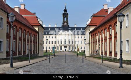 People walk across the courtyard at Hubertusburg Palace in Wermsdorf, Germany, 25 April 2013. The Dresden State Art Collections (SKD) is presenting a special exhibition to mark the 250th anniversary of the Peace Treaty of Hubertusburg in 1763 that ended the Seven Years' War. A few rooms were renovated in the empty palace at a cost of one million euros. Photo: JAN WOITAS Stock Photo