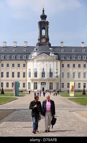 People walk across the courtyard at Hubertusburg Palace in Wermsdorf, Germany, 25 April 2013. The Dresden State Art Collections (SKD) is presenting a special exhibition to mark the 250th anniversary of the Peace Treaty of Hubertusburg in 1763 that ended the Seven Years' War. A few rooms were renovated in the empty palace at a cost of one million euros. Photo: JAN WOITAS Stock Photo