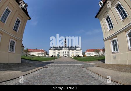 People walk across the courtyard at Hubertusburg Palace in Wermsdorf, Germany, 25 April 2013. The Dresden State Art Collections (SKD) is presenting a special exhibition to mark the 250th anniversary of the Peace Treaty of Hubertusburg in 1763 that ended the Seven Years' War. A few rooms were renovated in the empty palace at a cost of one million euros. Photo: JAN WOITAS Stock Photo